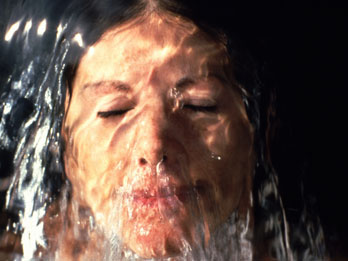 Running water over woman's face
