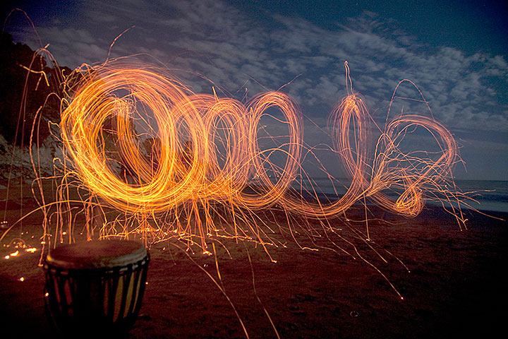 Light track from carbon neutral fire spinning toys made from Euculyptus bark. The person was 