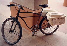 Transport bike with lockable, waterproof carrier bins.